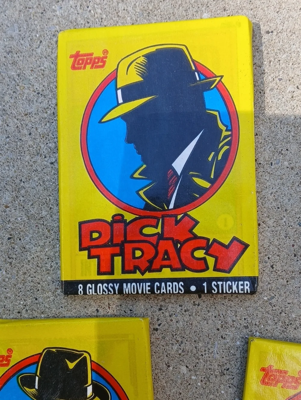 five unopened packs of 1990 Topps Dick Tracy movie trading cards.